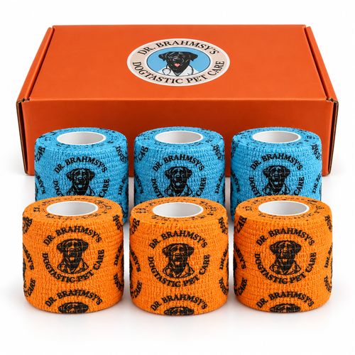Six rolls of Dr. Brahmsy's Dogtastic elastic bandages, three blue and three orange, in front of the orange carton